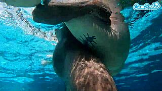 Amateur camgirl gets hit by a black rod underwater