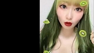 Hot Japanese woman dances and shows her big boobs at the pool