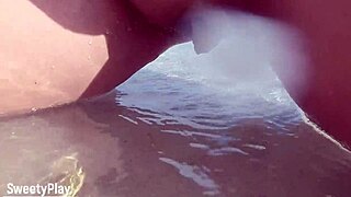 shaved pussy dripping while peeing on a public beach, wanna see?