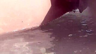 Close up of a shaved pussy while taking a pee outdoors on a public beach