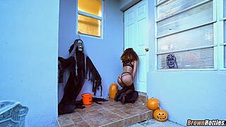 Black beauty enjoys Halloween glory hole session with a white man