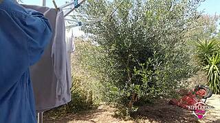 Kinky MILF plays with pierced nipples outdoors boldly