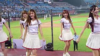 Cheerleaders in sexy uniforms cheer for the baseball team with enthusiasm