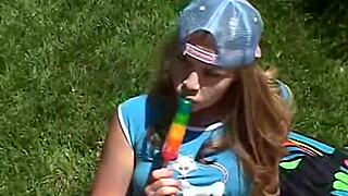 Little april is out rubbing her clit and sucking on a popsicle