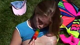 Little april is out rubbing her clit and sucking on a popsicle