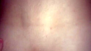 The guy sits on the macho man's dick.