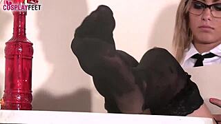 blonde ballerina teases in black dotted stockings playfully