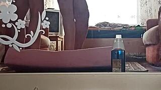 Kazakh couple films an intimate home video with steamy pussy action.