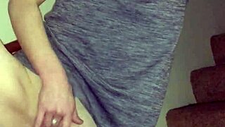 wife teases with pierced pussy while rubbing on the stairs.