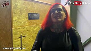 busty redhead jerks cocks in gloryhole