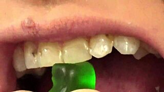 close up of fifi foxx eating gummy bears