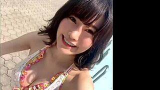 Japanese babe shows off big boobs in sexy pool dance