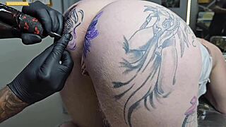 Gay guy modifies anal tattoo in public outdoors