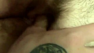 He helps her play with her pussy, fingering the clit in close-up.