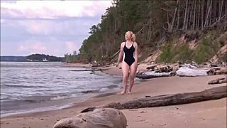 blonde babe in costume charges at sea during workout