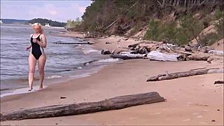 blonde babe in costume charges at sea during workout