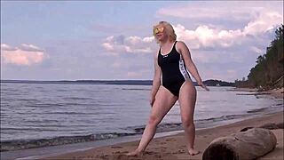 blonde babe in costume charges at sea during workout