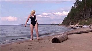 blonde babe in costume charges at sea during workout