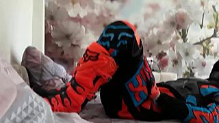 Motocross gay in biker costumes, boots treading on the action.