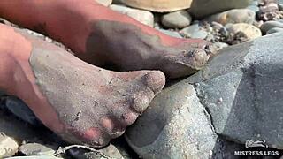 Goddess Teases With Messy Nylon Feet On River Bank