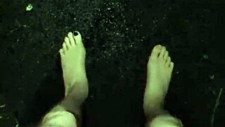 Masturbating in the rain, this guy goes wild with his huge tool.