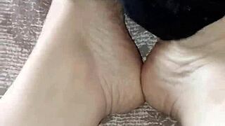 Gretala rubs her thong against her bare feet