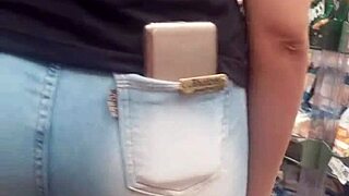 A Brunette Shows Off Her Hot Ass In The Market While Being Spied On.