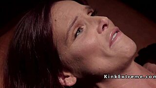 Bound participant in restraint activity with manual stimulation and domination elements