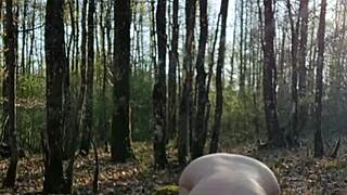 female slave performs outdoor self-session in bizarre setting