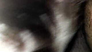 An interracial scene featuring moaning and deepthroat actions in a casual setting.