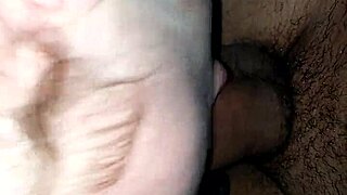 An interracial scene featuring moaning and deepthroat actions in a casual setting.