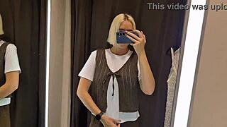 Blonde tries on sexy clothes in mall fitting room