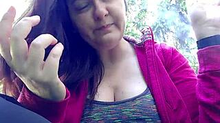 Nicoletta lights up a smoke in a public garden and boldly flashes her large tits by exposing them from her shirt