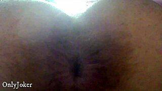 Brunette spreads ass wide for solo anal play.