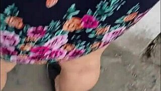 Caught this chubby teacher on the street, skirt and thong flashing big natural tits.