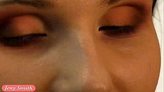 jeny smith in red corset and stockings during photoshoot, teasing with legs and feet