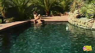 Two Busty Blondes In Bikinis Enjoy Lesbian Fun In The Pool
