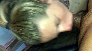 The blonde girlfriend with tattoos demonstrates her sloppy deepthroat technique, sucking and swallowing every drop.