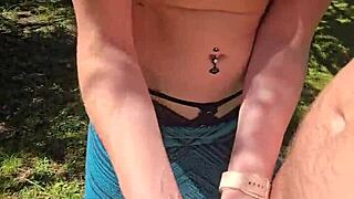 the wife gives a quick handjob to her husband while they're out on a walk