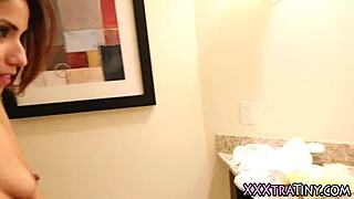 A petite Latina teen eagerly sucks a massive cock