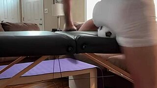 Stretching groin in tight spandex shorts with mini ball on desk