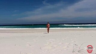 The naughty brunette gave me a blowjob on the beach in front of the bathers.