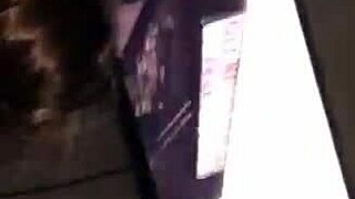 Bound and masked woman sucking cock in bondage.