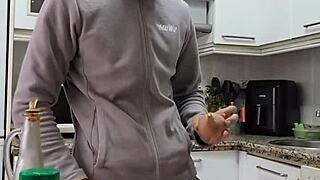 Pornstar undresses while cooking, masturbates, and cums on the food.