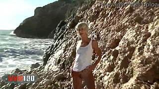 nice blonde nicky wayne removing clothes by the sea feels liberating