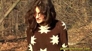 a person pissing outdoors in a secure location for fetish purposes