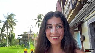 Skinny brunette flashes tight pussy in public cafe then gets facial from waiter.