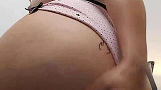 Cute redhead subtly flashes her breasts and pink pussy