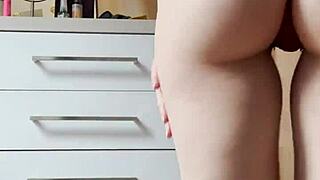 homemade video of petite blonde teen doing striptease dance in tight jeans in bedroom