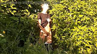 in a daring outdoor adventure, a brunette woman explores self-pleasure amidst nature, leading to an intense personal climax